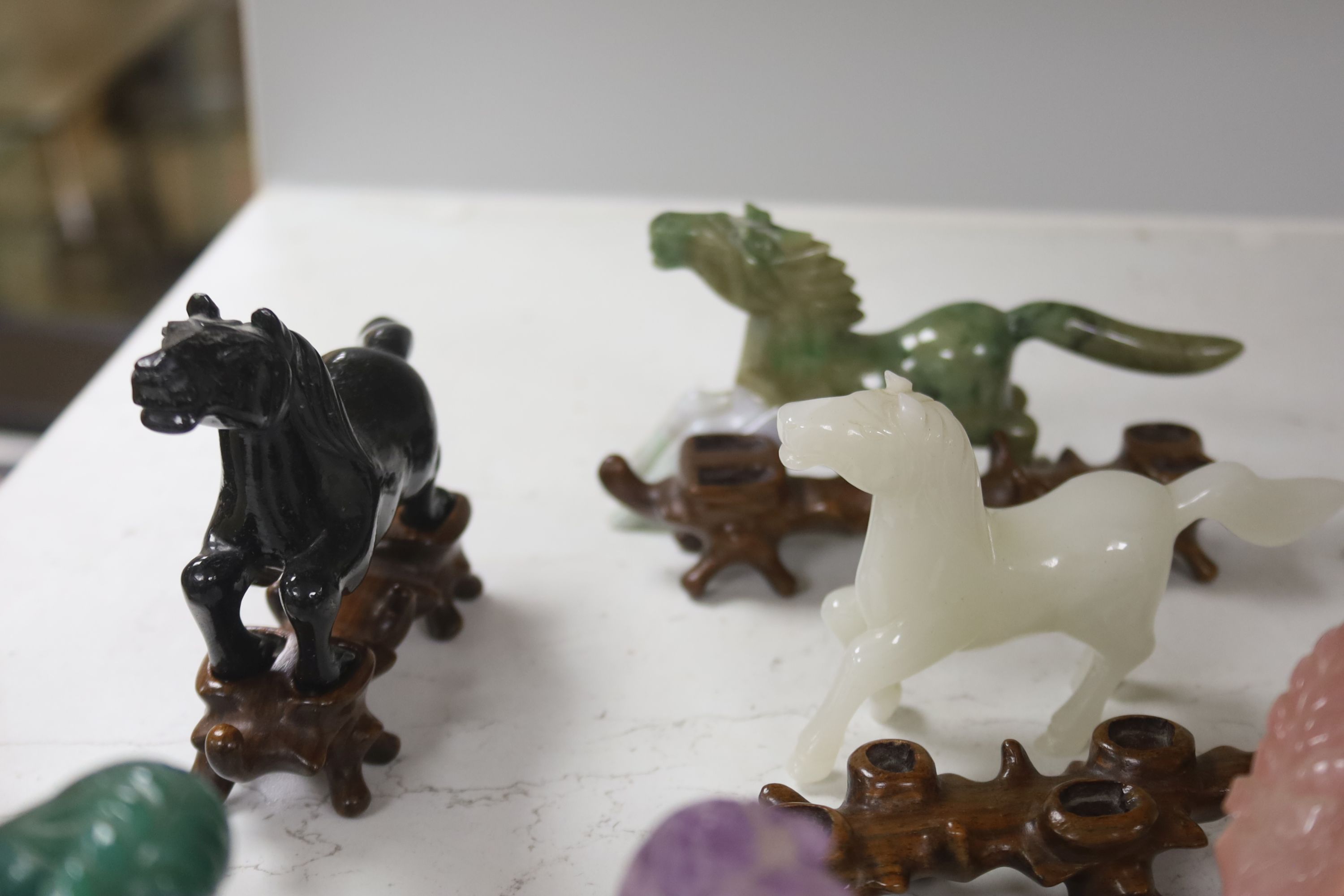 Eight Chinese 20th century carved hardstone 'Horses of Mu Wang'